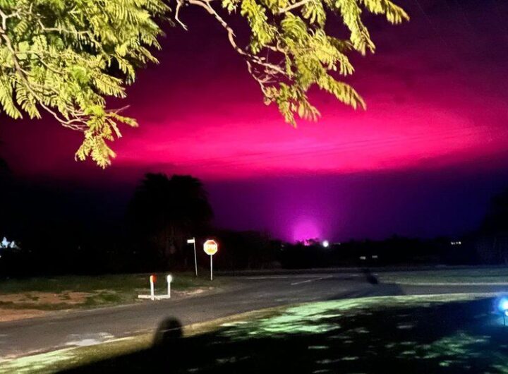 'Not aliens...': Cannabis farm behind eerie pink sky over Australian town